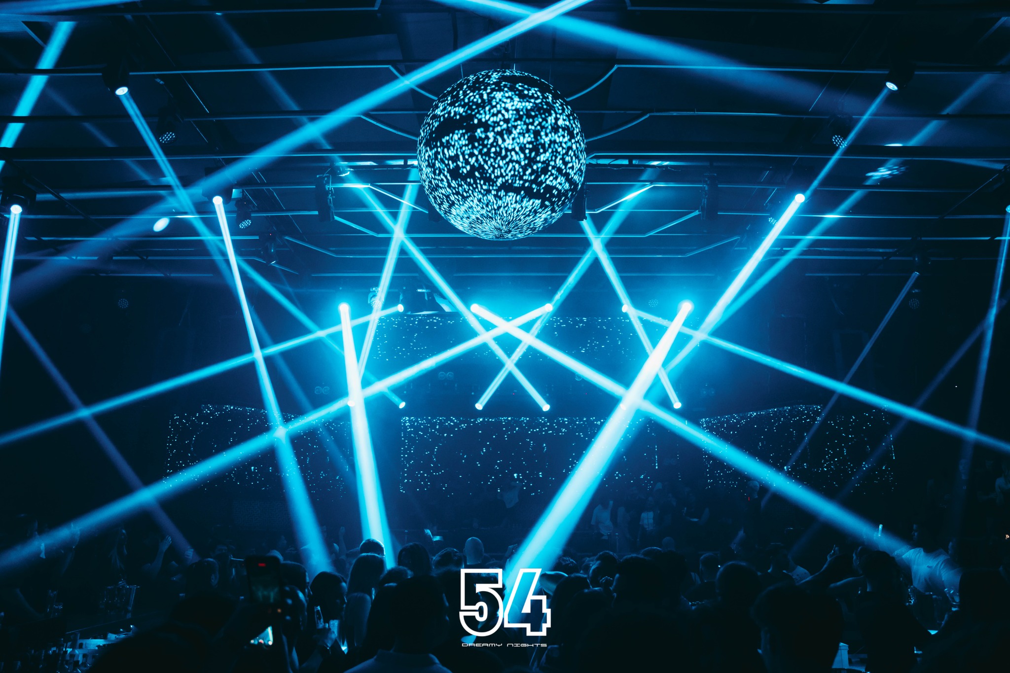 Crowd cheering with hands up